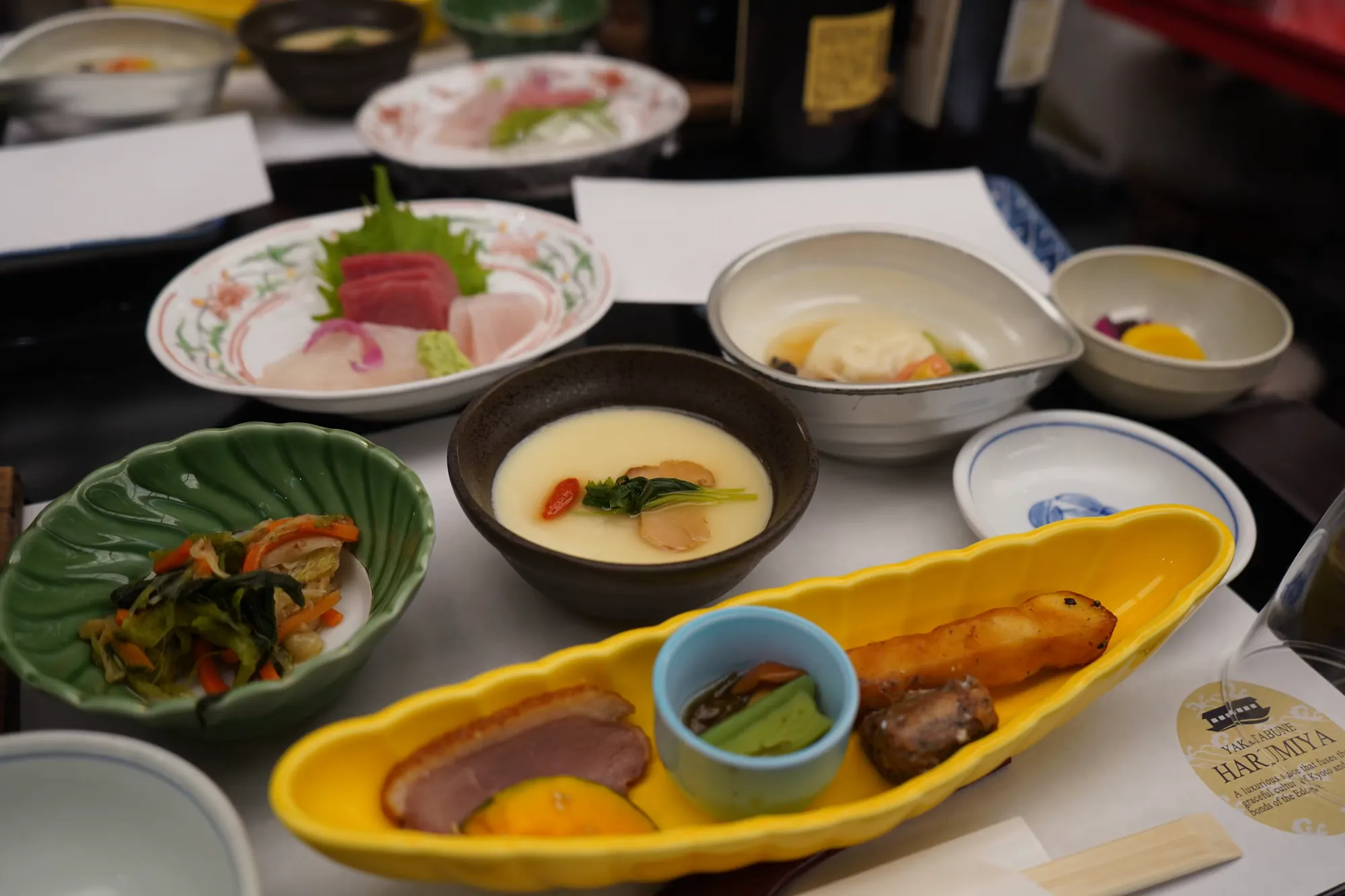 A refined kaiseki meal arranged on handcrafted ceramic tableware