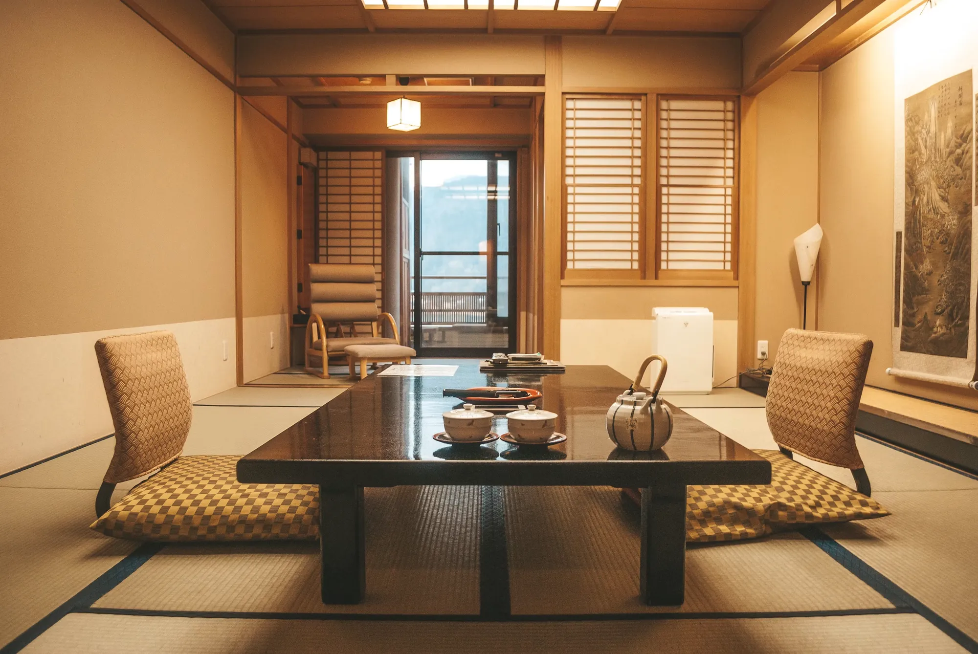 A warm, quiet Japanese hotel room prepared for a restful stay